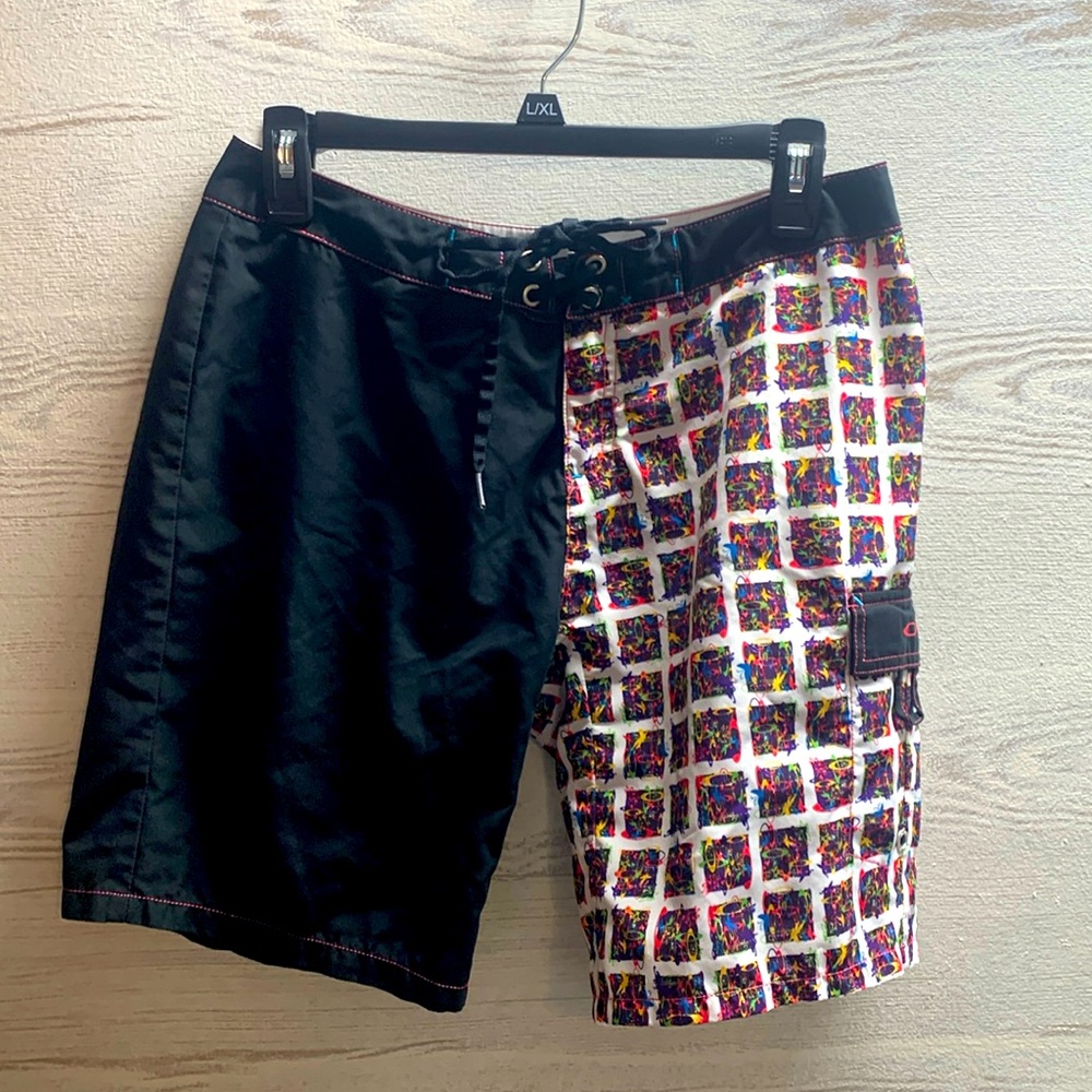 Oakley black and graphic board shorts size 4